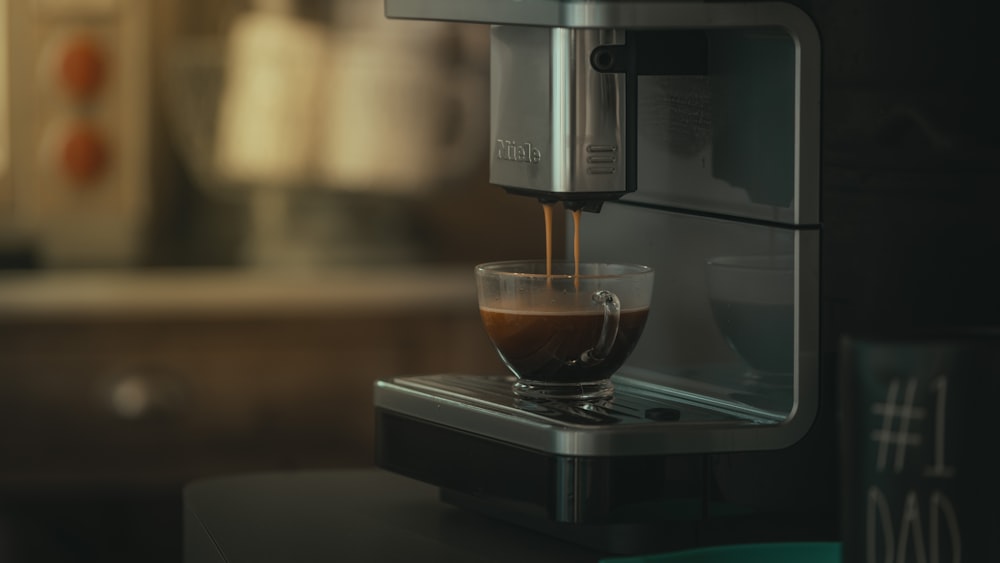 a glass of liquid on a machine