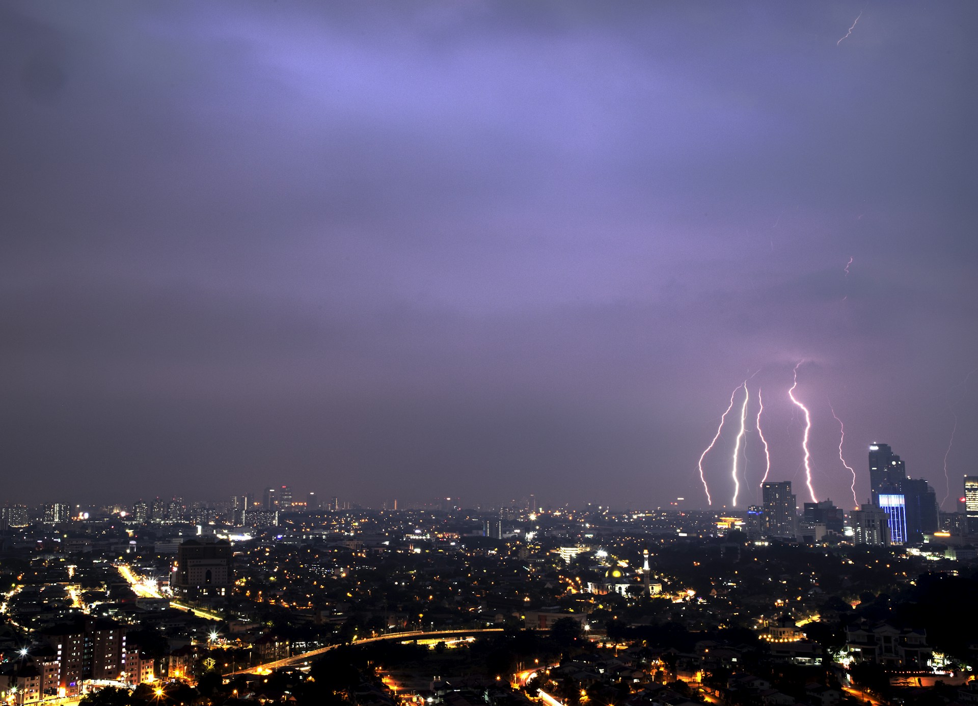 a city with fireworks in the sky