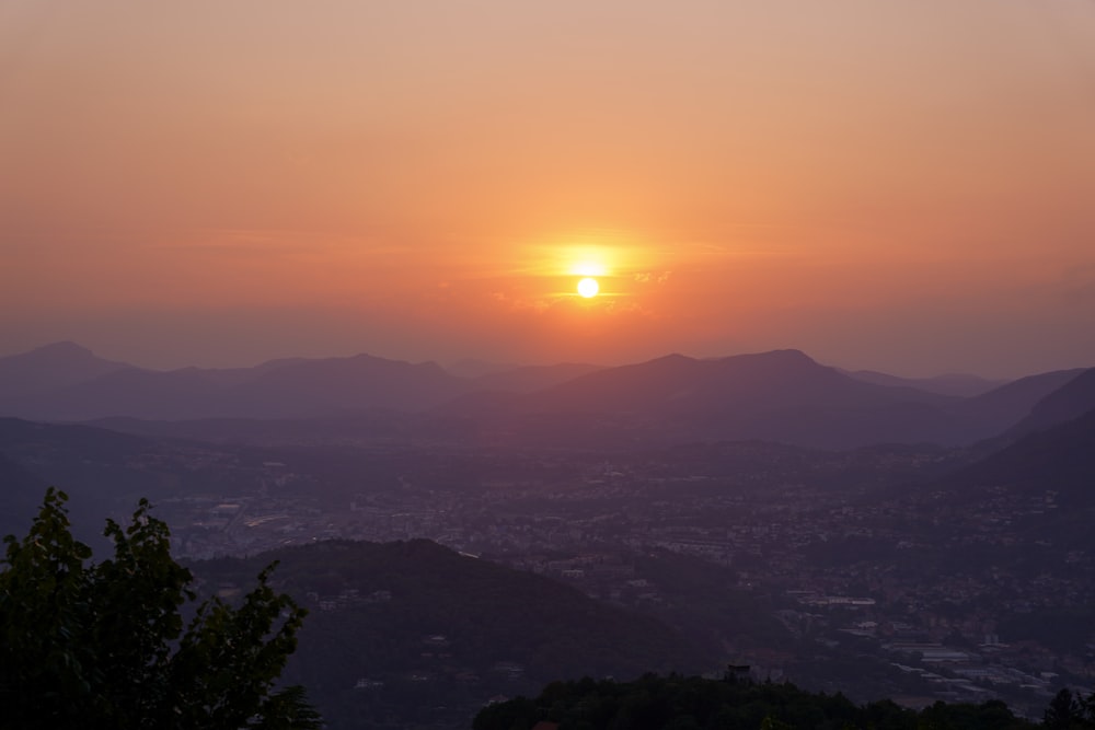 a sunset over a mountain range