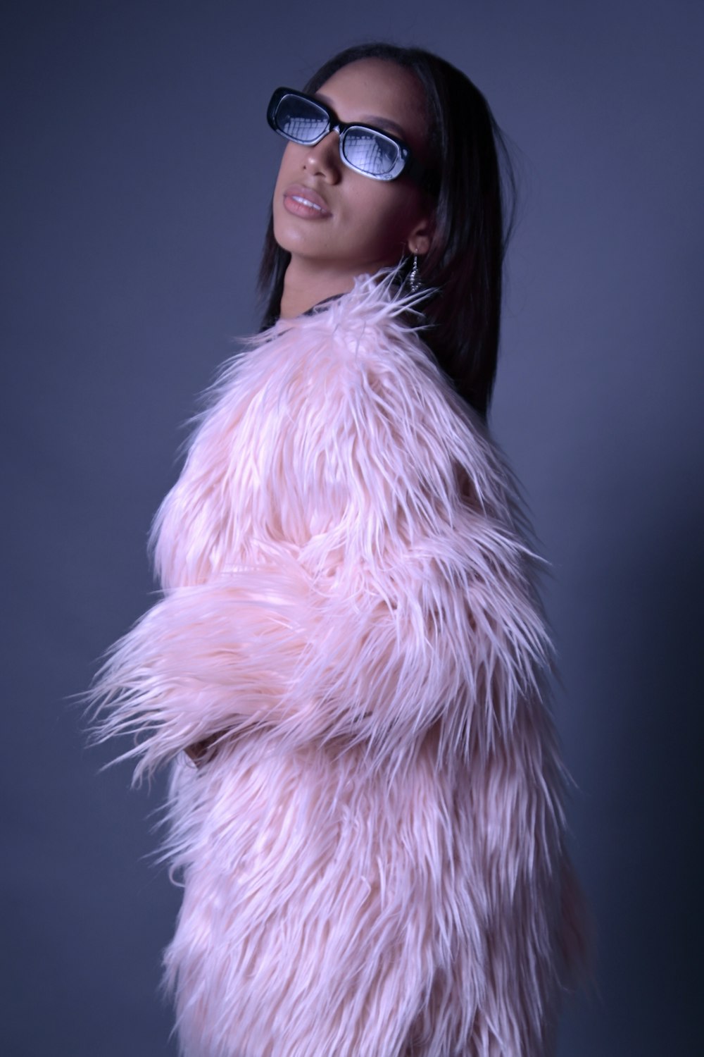 a person wearing a pink fur coat