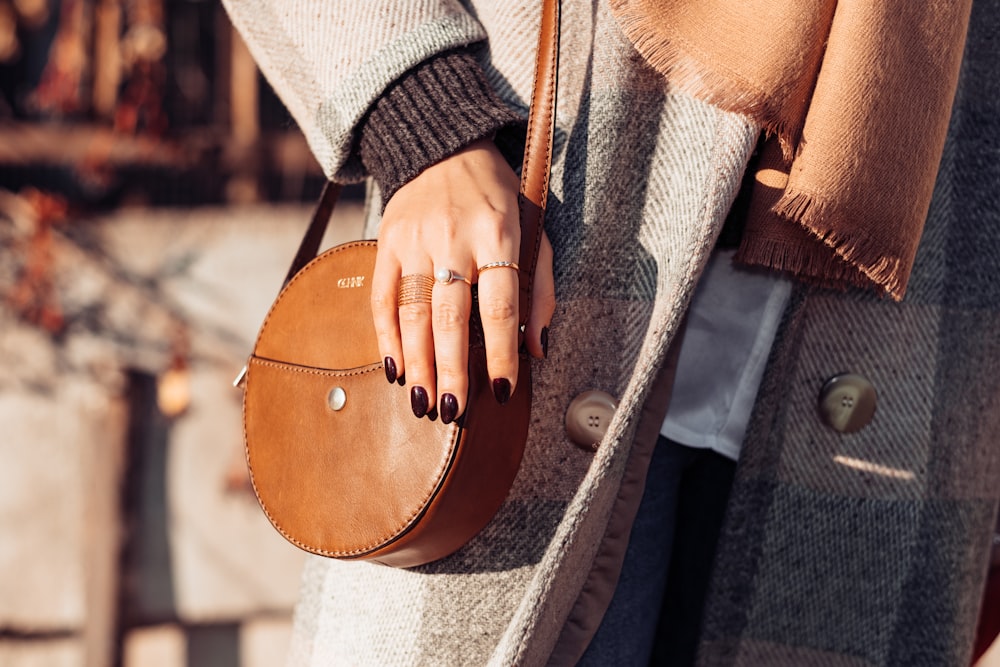 a person holding a purse