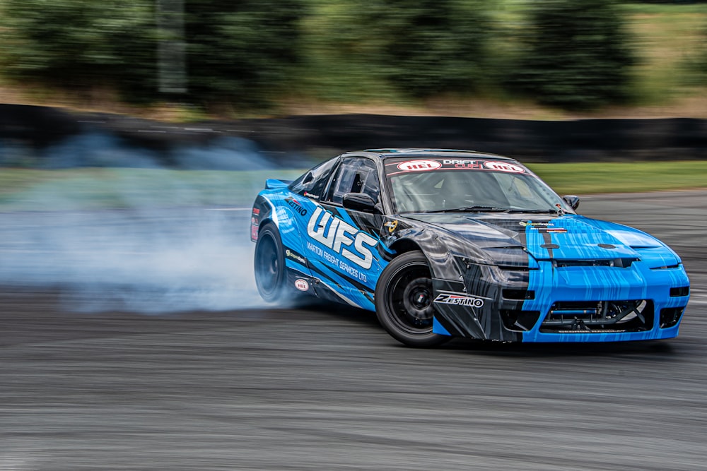 a blue race car on a track