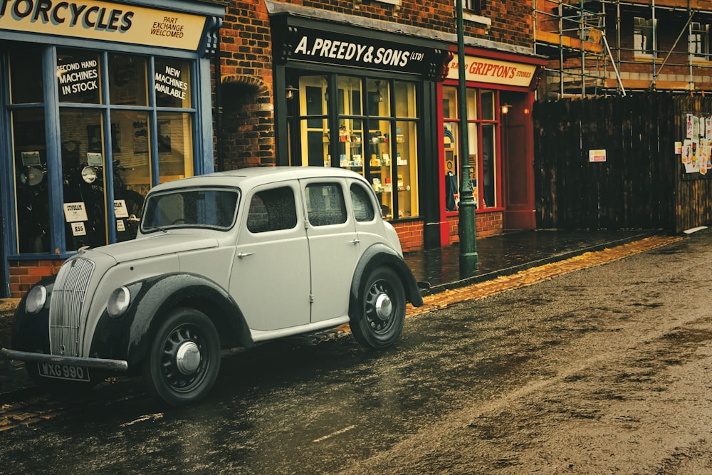 a white car parked outside a store