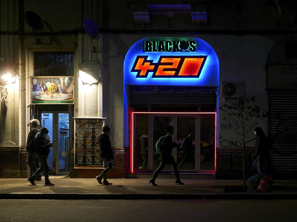 a group of people walking out of a building