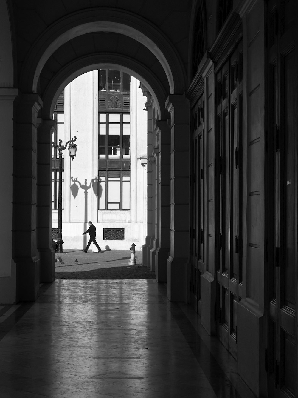 a person walking down a hall way