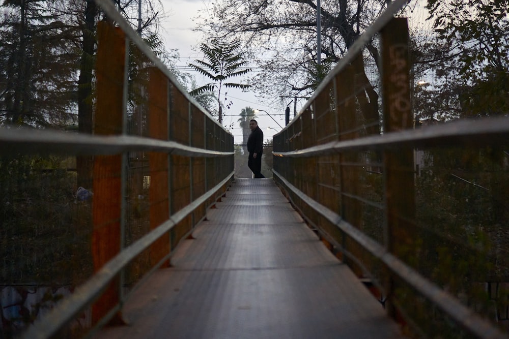 a person walking on a bridge