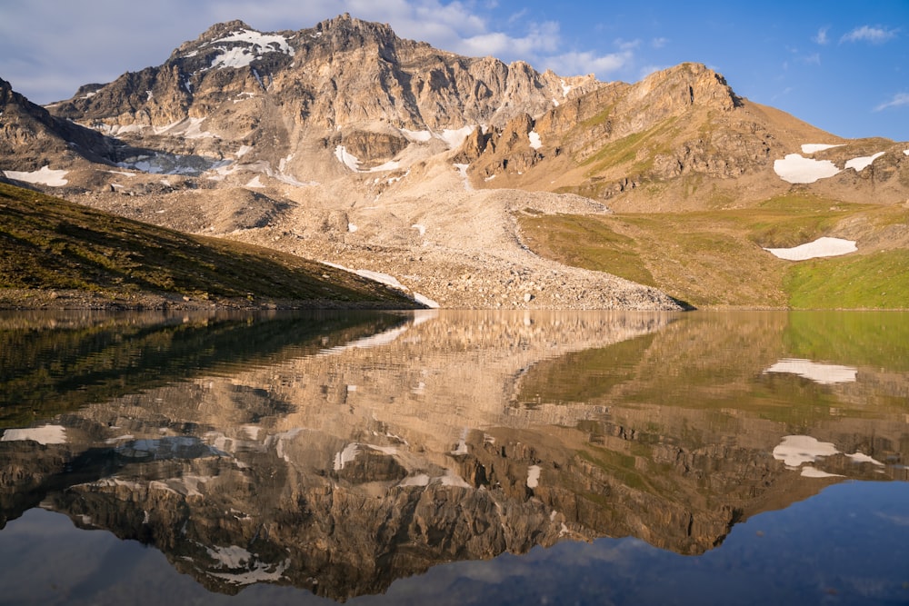 a lake in a snowy mountainous region