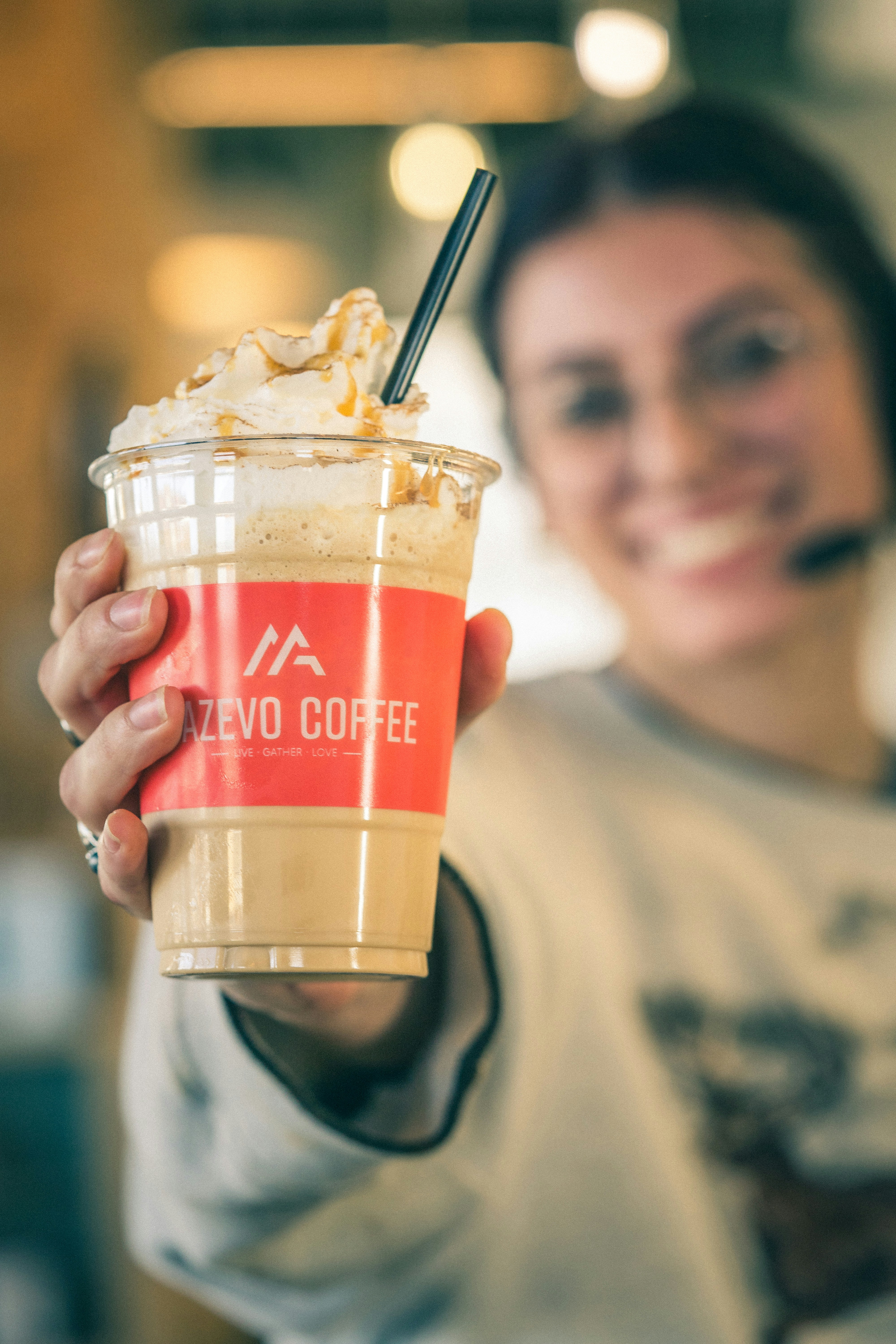 a person holding a drink