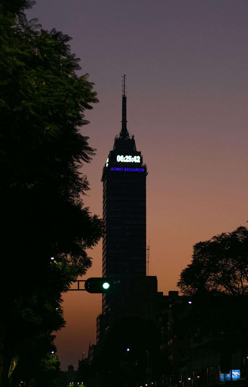 a tall building with a lit up top