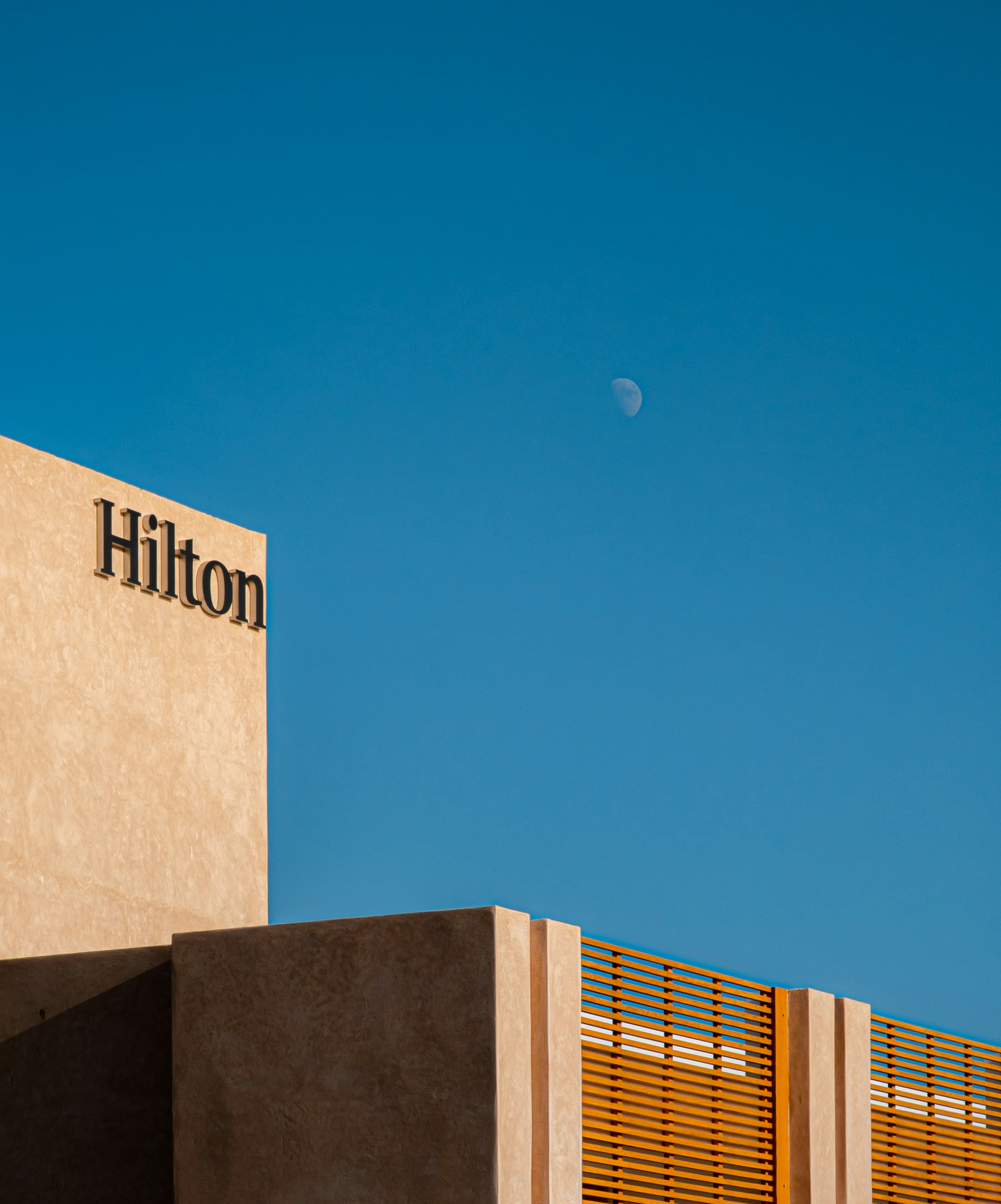 a building with a moon in the sky