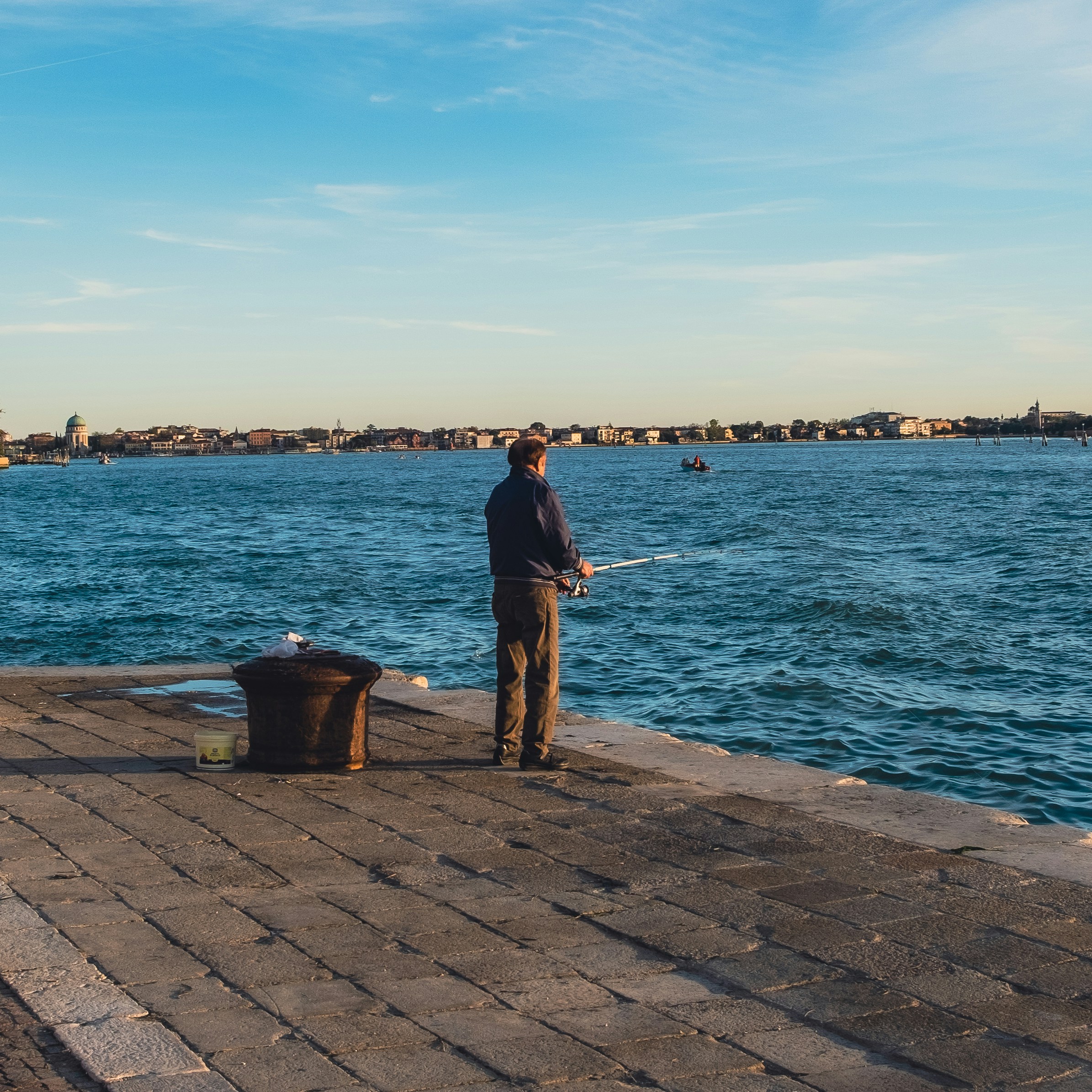 a man fishing on a dock
