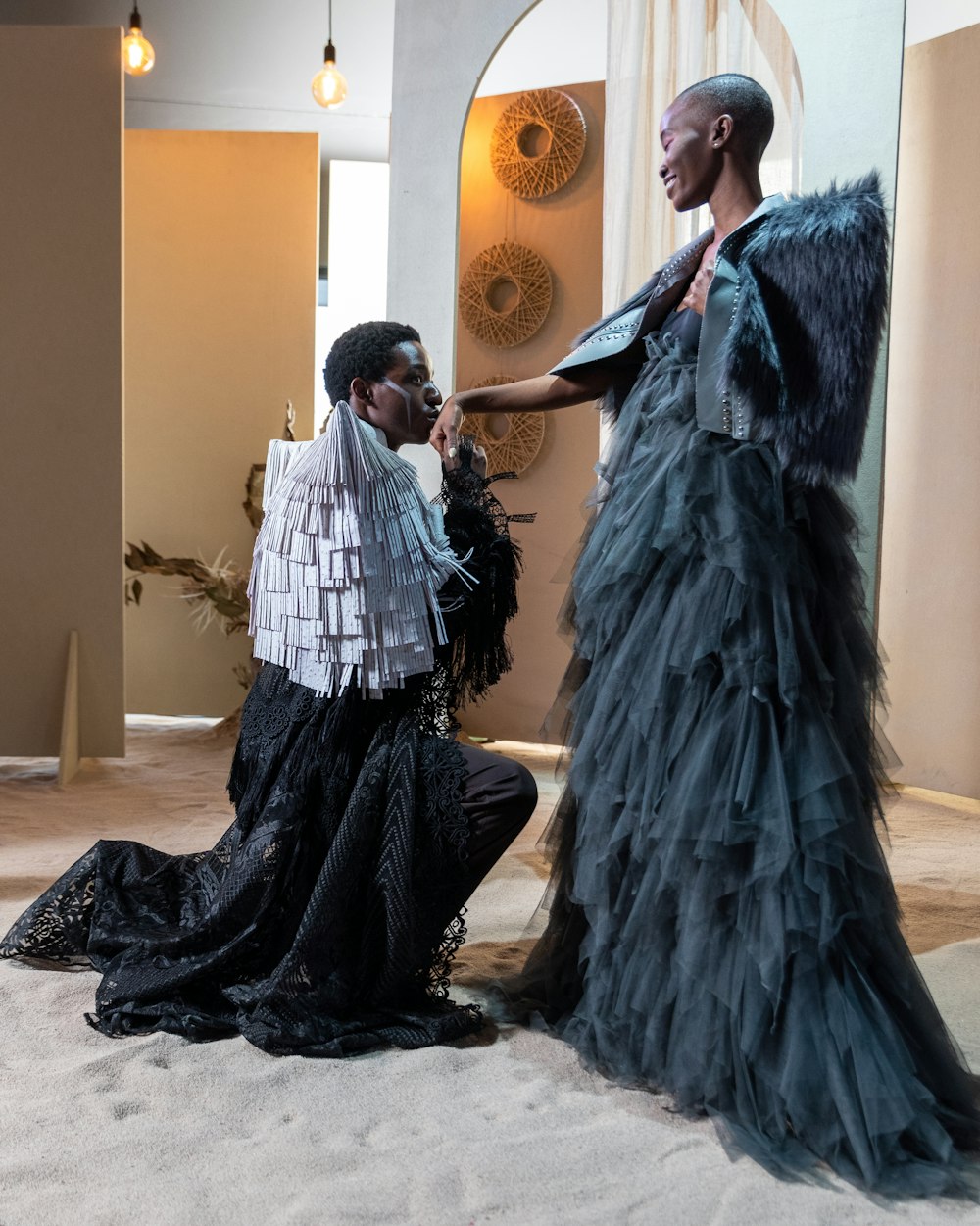 a man in a dress dancing with a woman in a dress