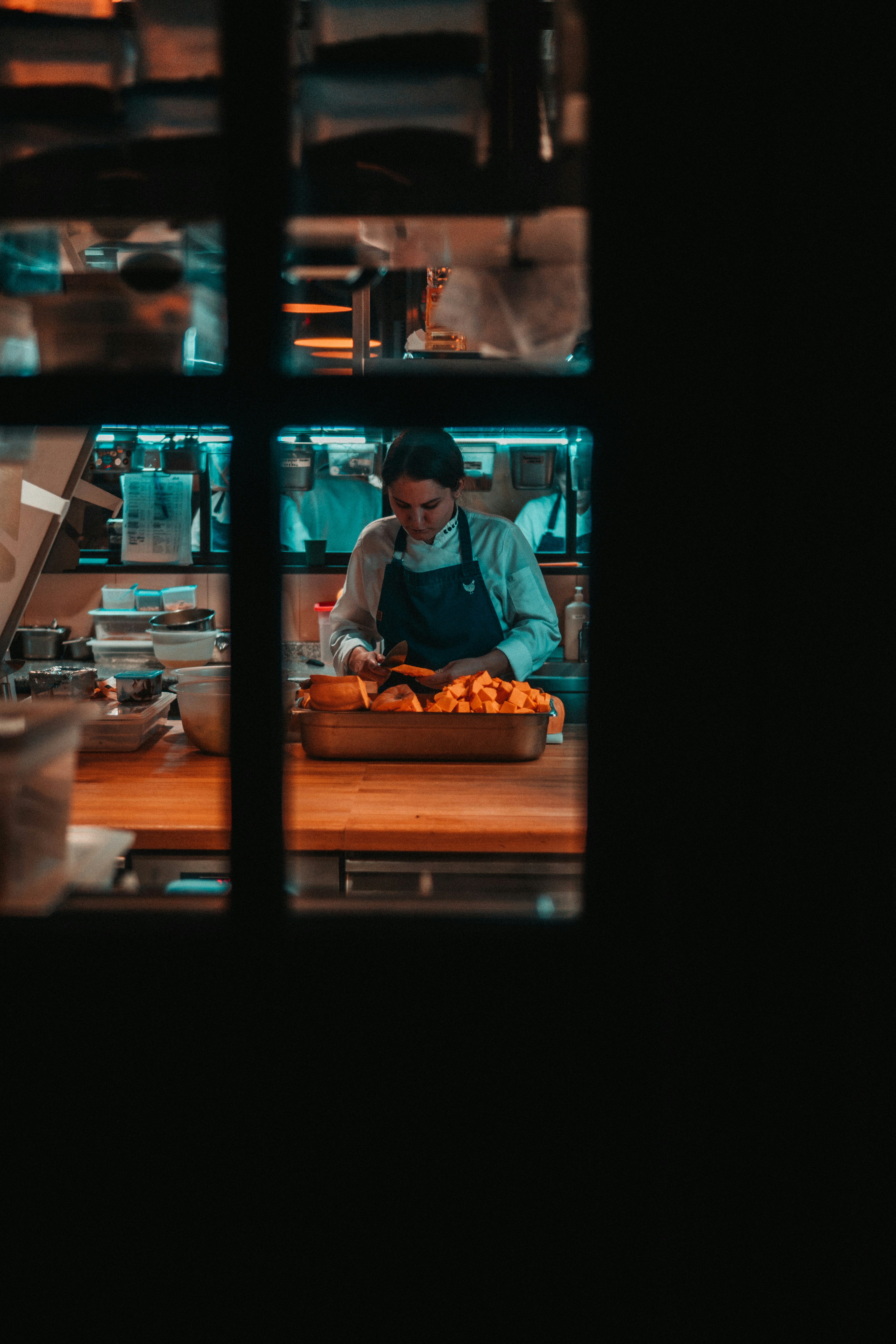 Home chef preparing a meal using smart kitchen tools.