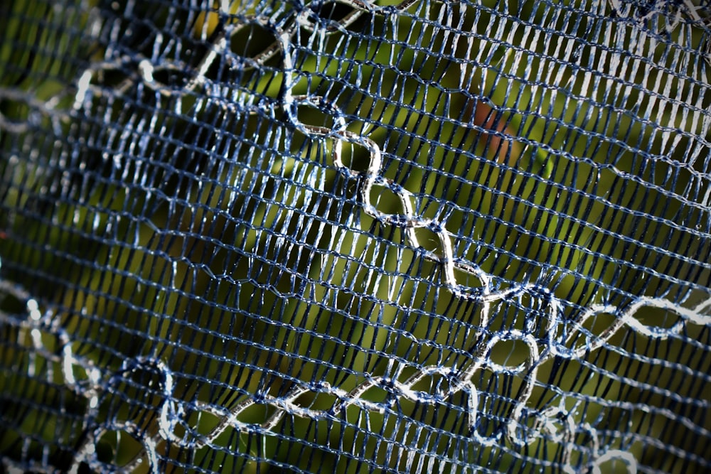 a close-up of a chain link fence