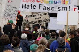 Activists holding signs advocating for fair wages during a peaceful rally.