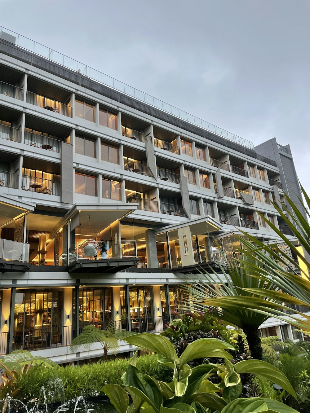 a building with plants and trees