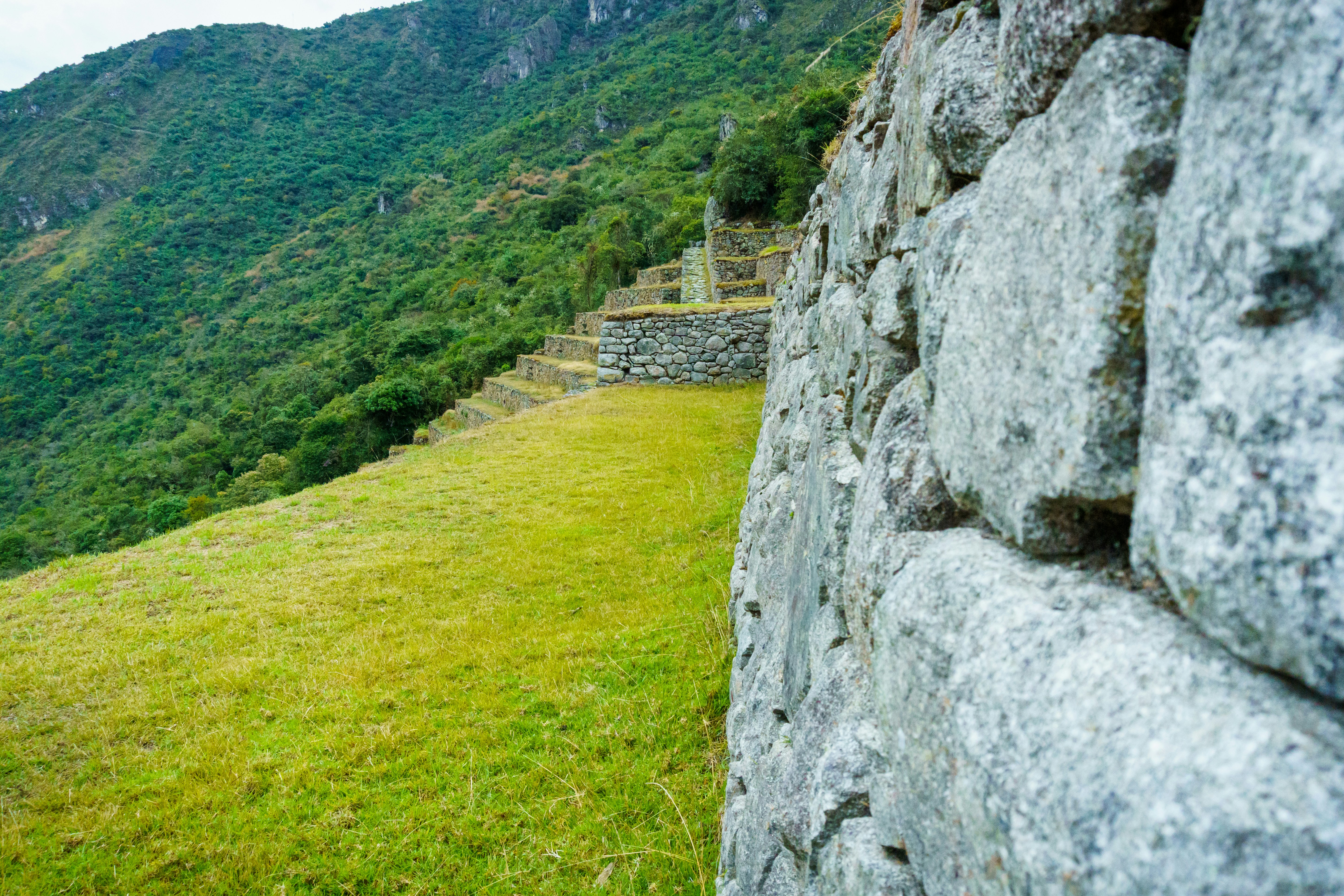 a stone wall on a hill