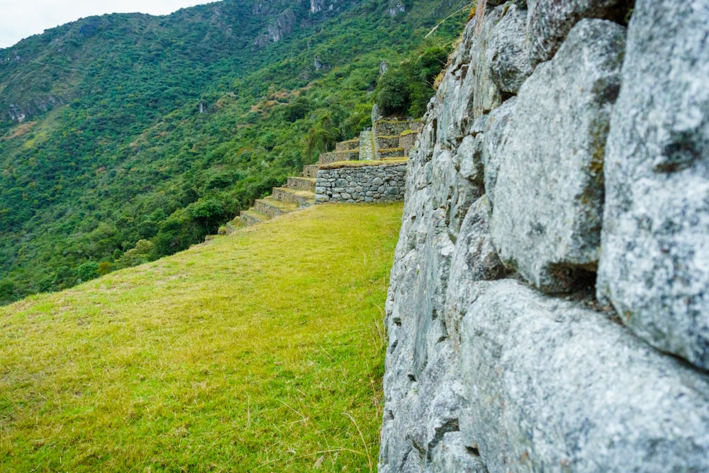 a stone wall on a hill