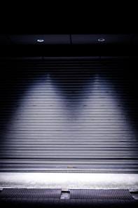 a black rectangular object with a light on it