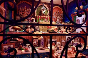 A close-up of a black and purple altar adorned with umbanda and witchcraft artifacts.