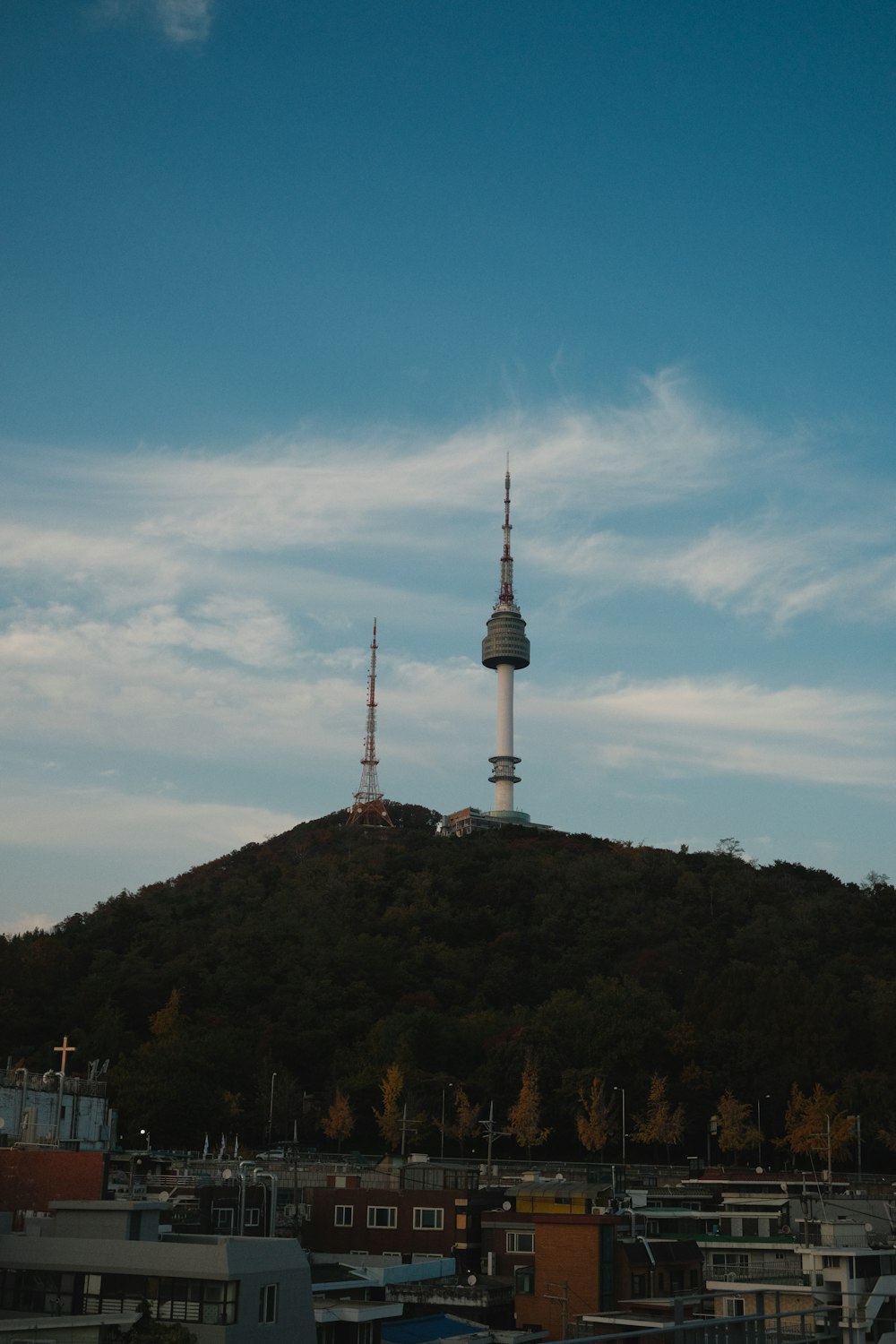 a tall tower on a hill