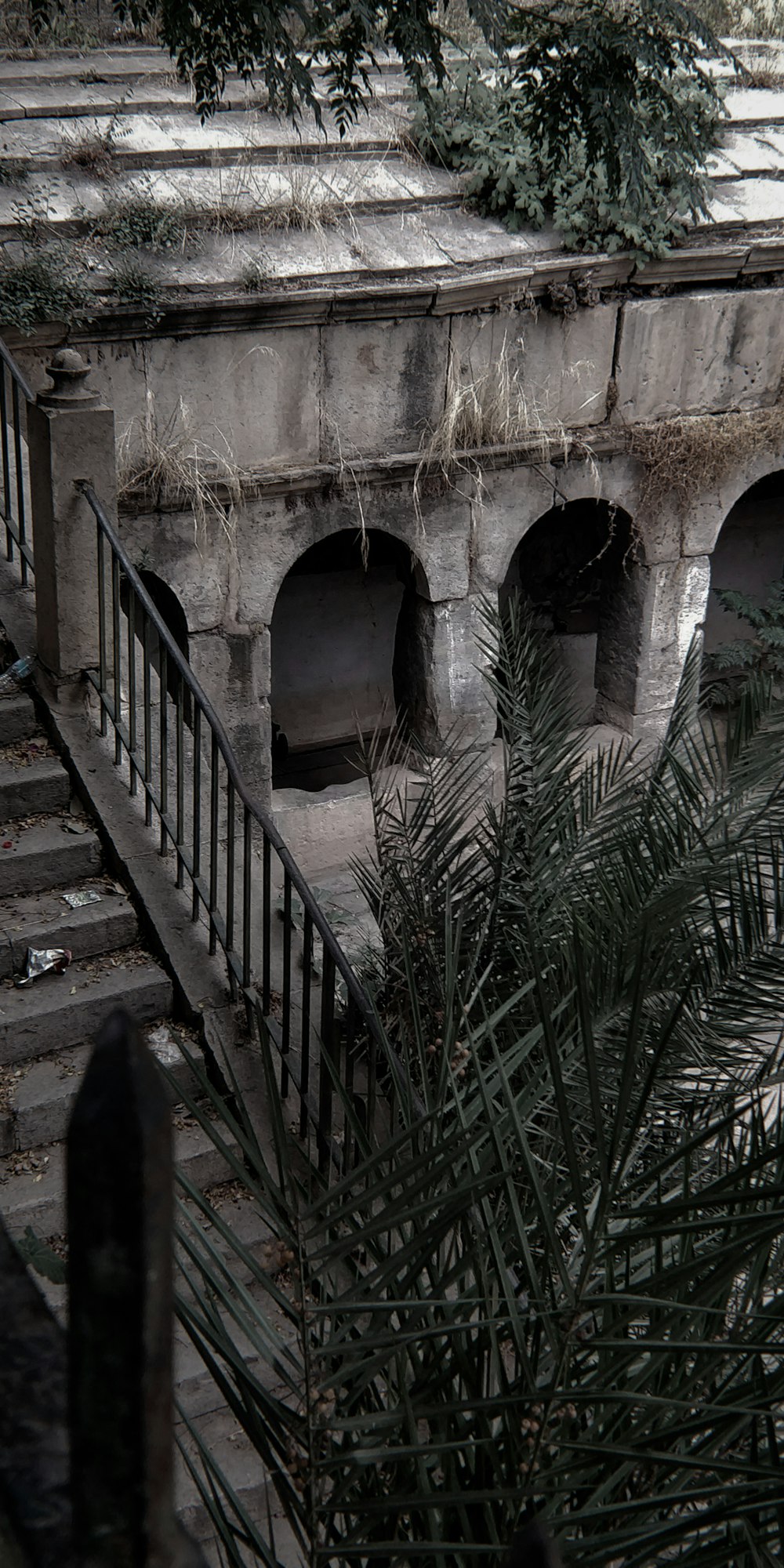 a stone building with a fence