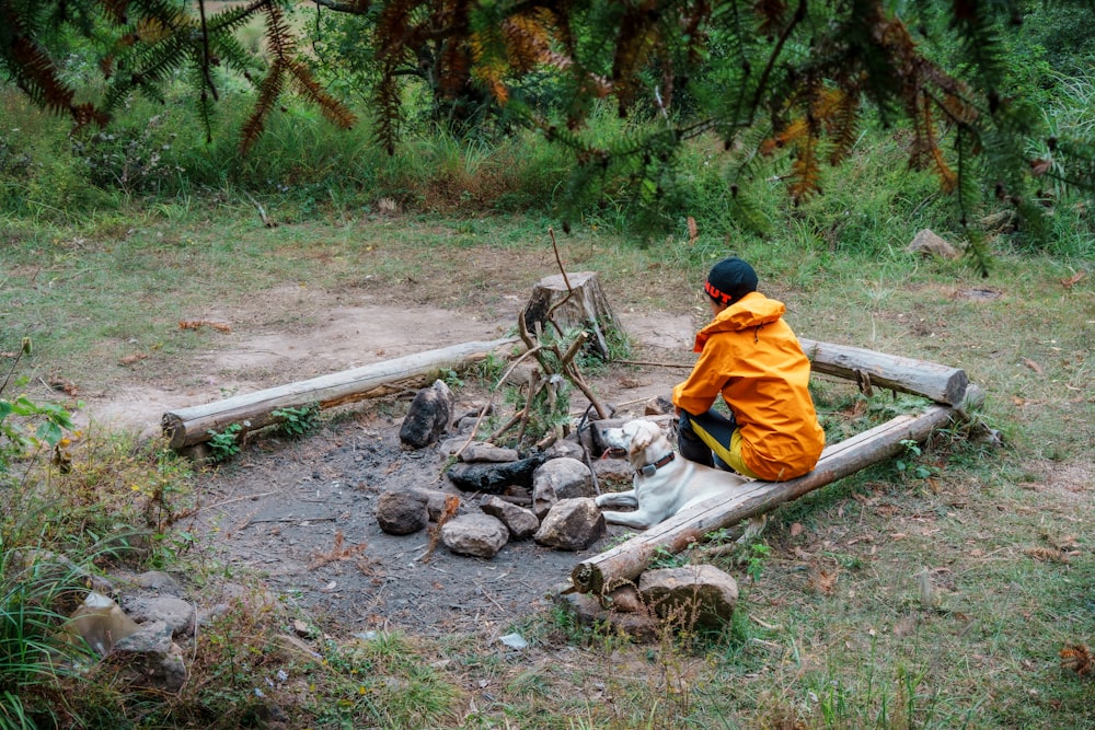 a man sitting on a log