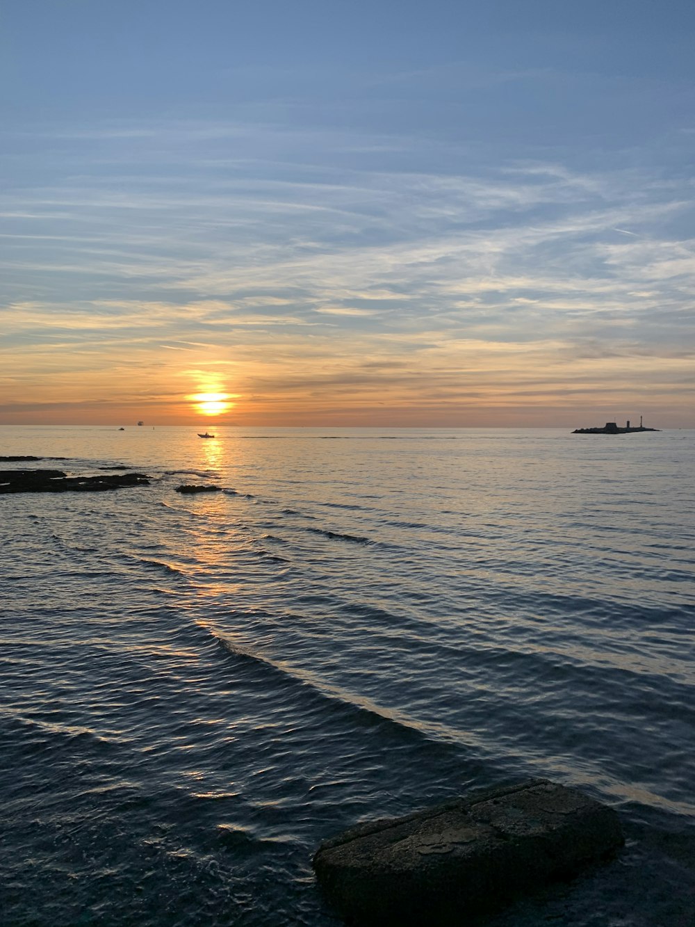 a sunset over a body of water