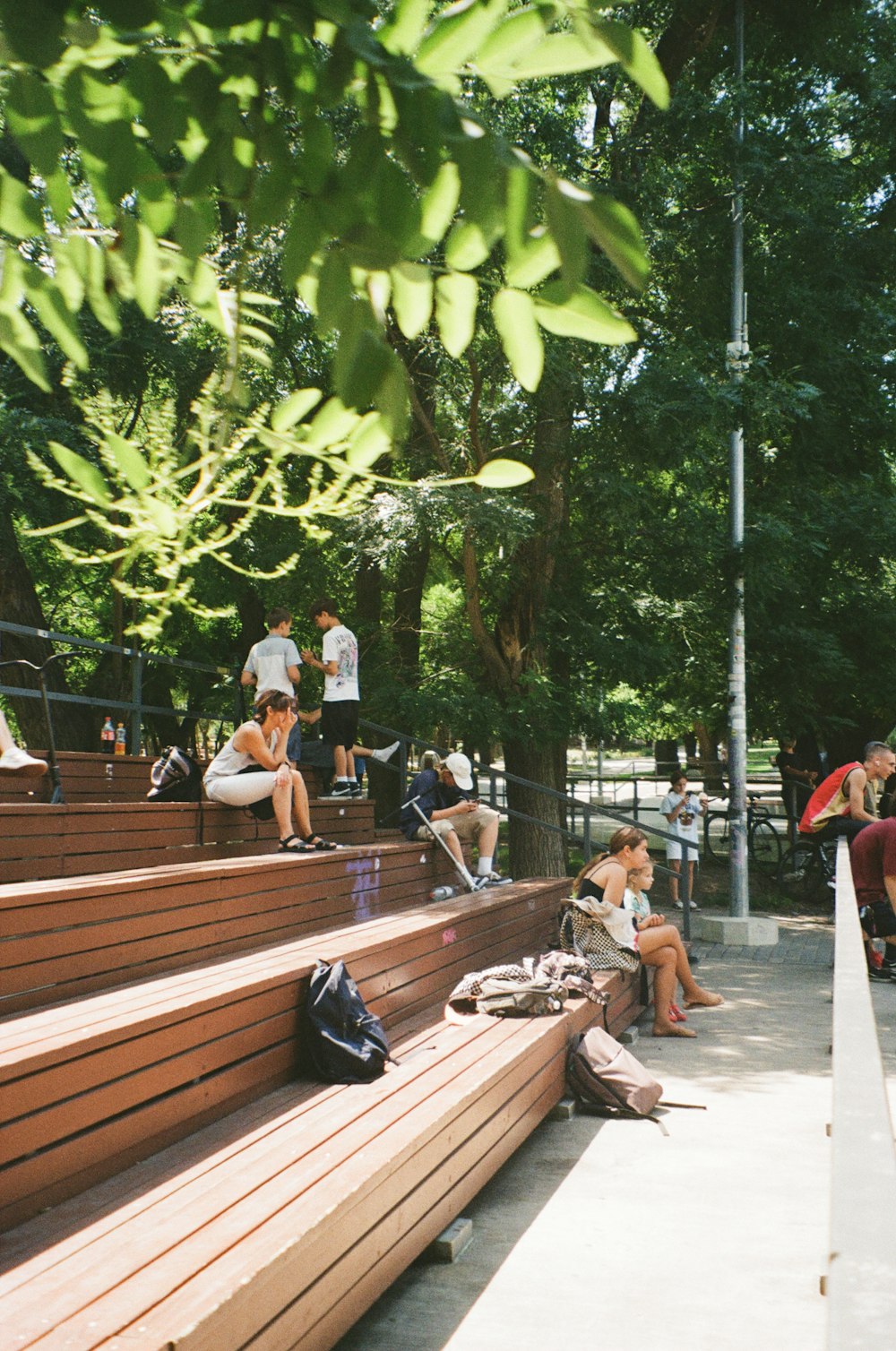 a group of people sitting on benches