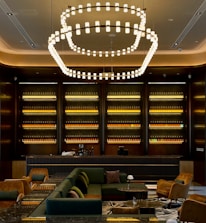 a room with a chandelier and chairs