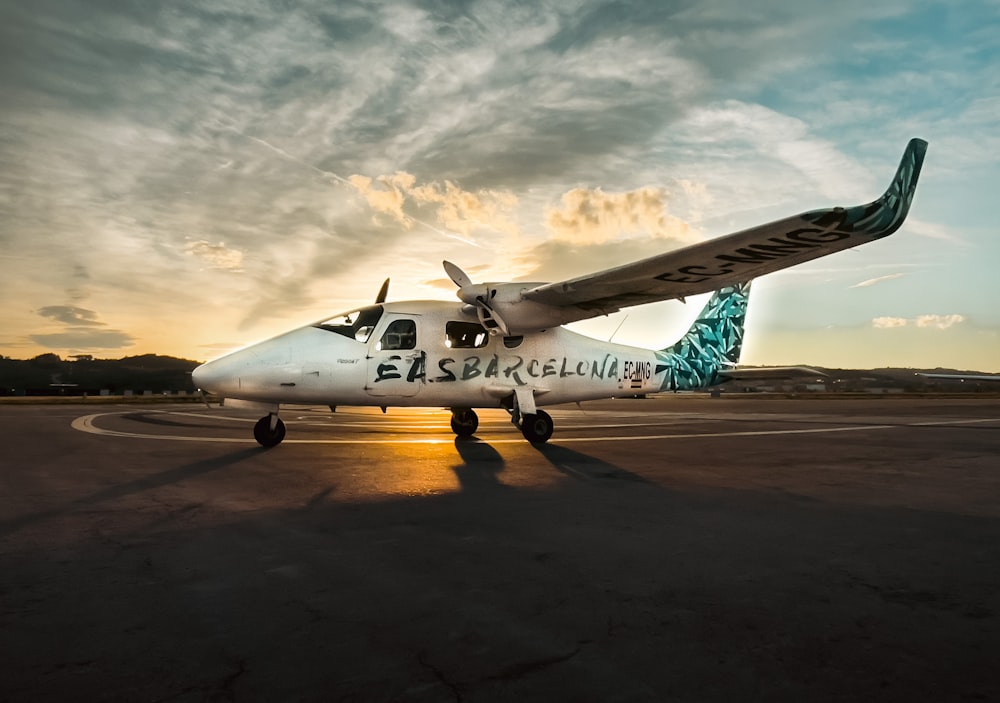 a white airplane on a runway