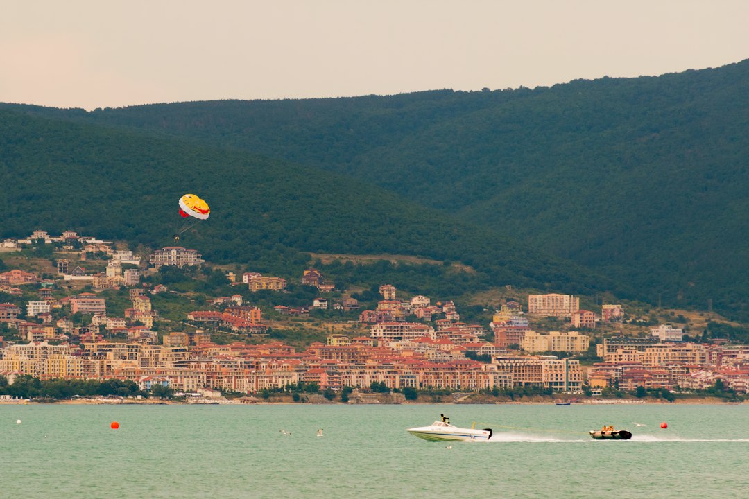 a person parasailing on the water,