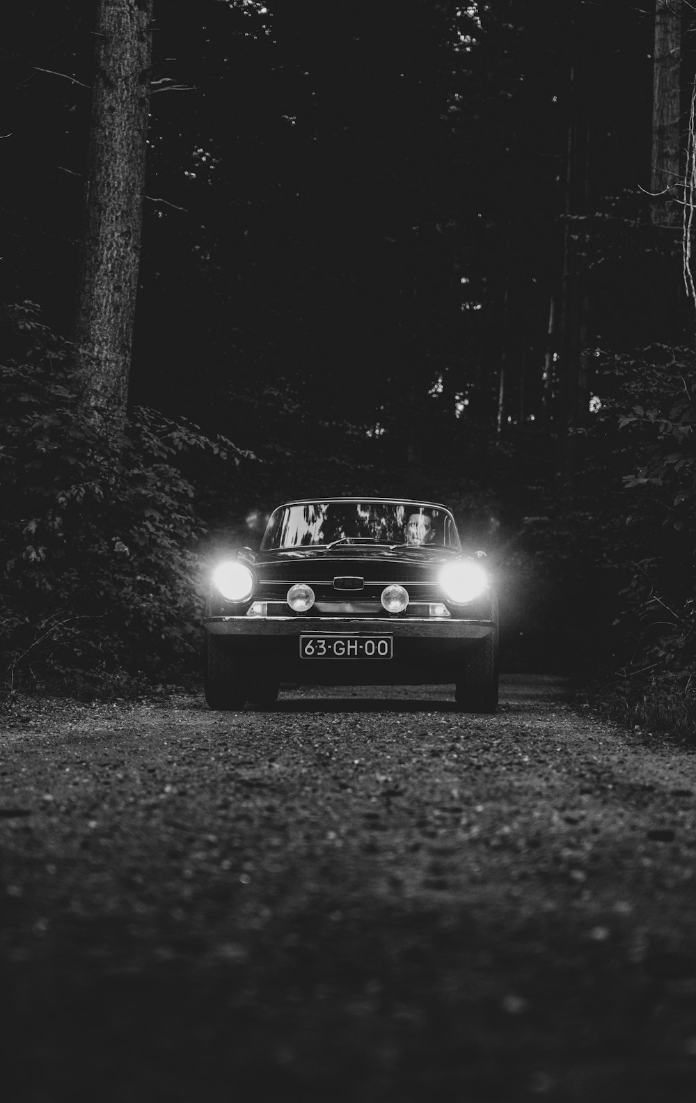 a car with headlights on at night