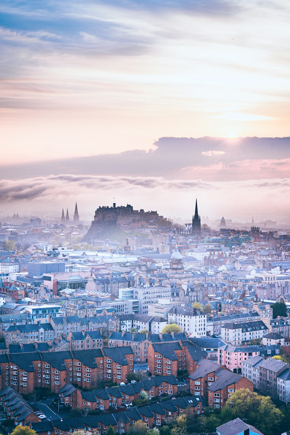 a city with a castle in the distance