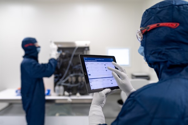 A food-facility team member using the FoodReady platform on a tablet