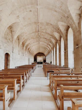 a large church with rows of wooden benches