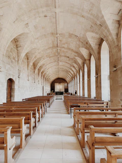 a large church with rows of wooden benches
