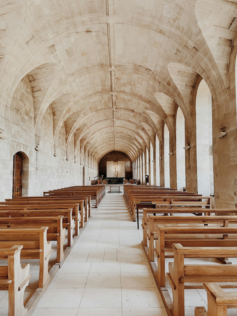 a large church with rows of wooden benches