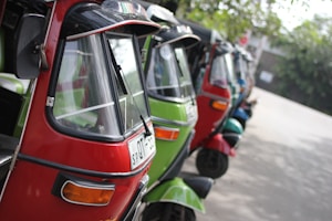 a row of red and green scooters