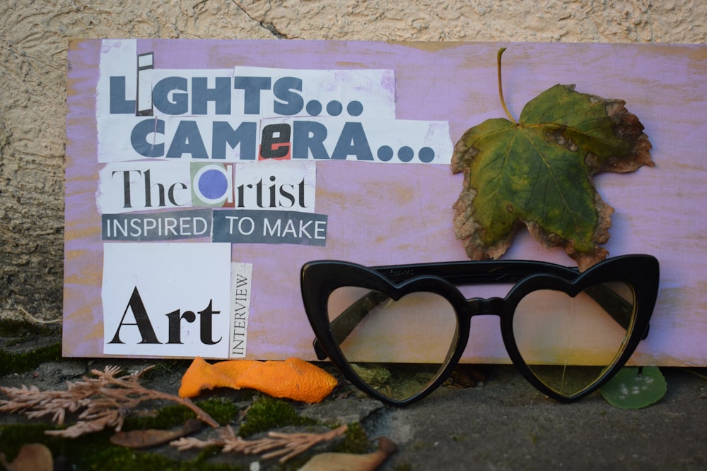 a book with glasses and a leaf on it