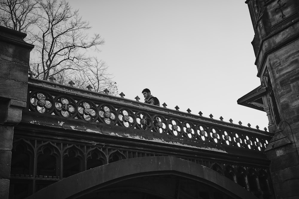 a person sitting on a balcony