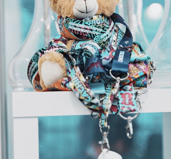 a teddy bear in a glass display