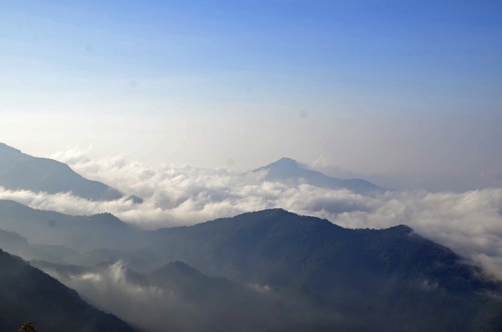 a view of the mountains and clouds