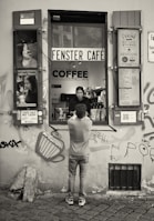 Sarina and Guido interacting with customers at their café.