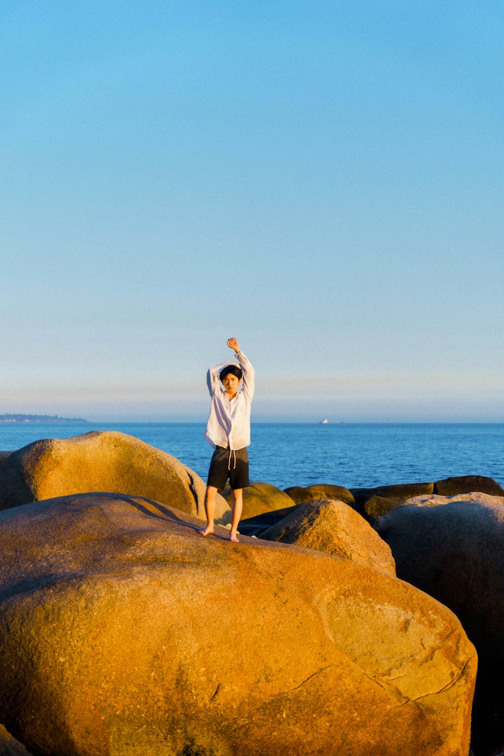 a person standing on a rock