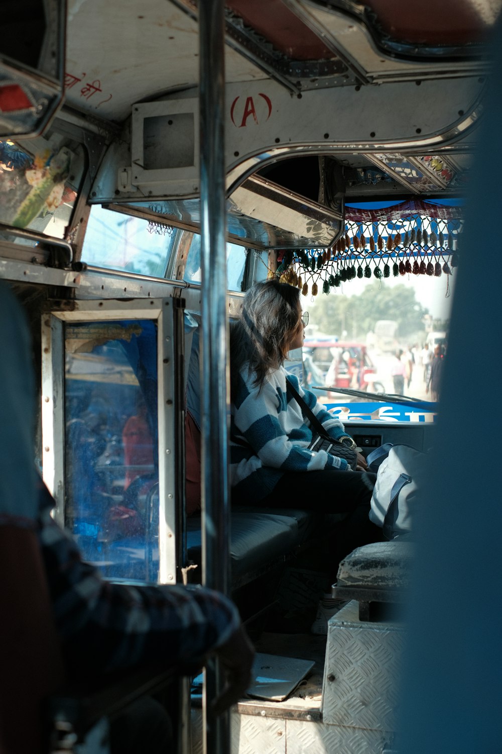 a person sitting in a bus