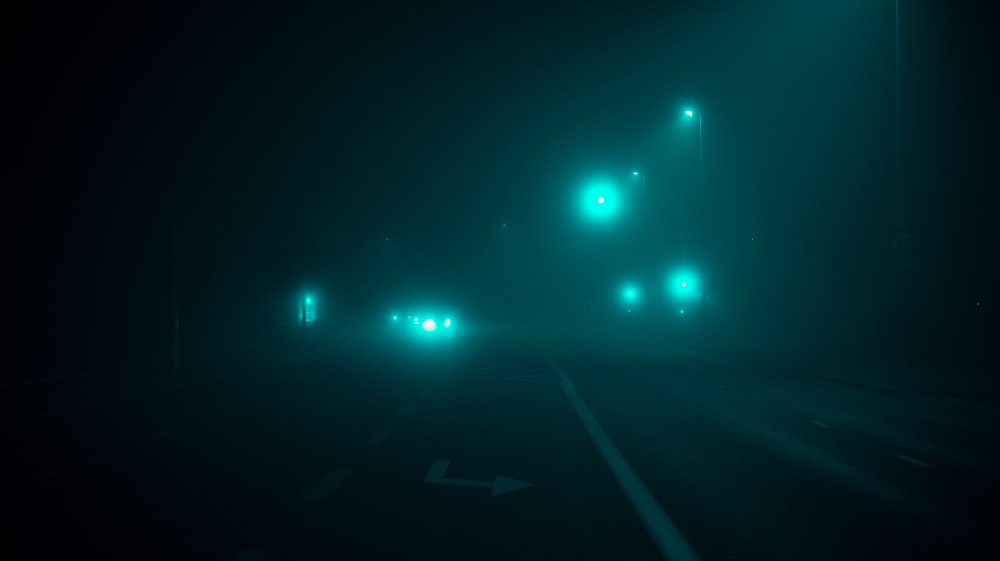 a car driving in the dark