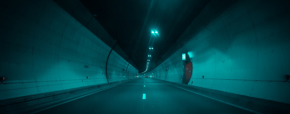 a tunnel with a car driving through