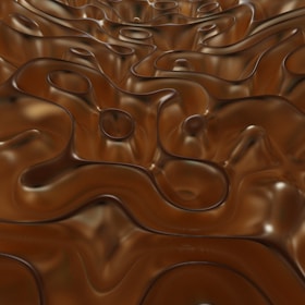 Close-up of a dark mocha epoxy floor with smooth, glossy finish and subtle 3D texture effects.