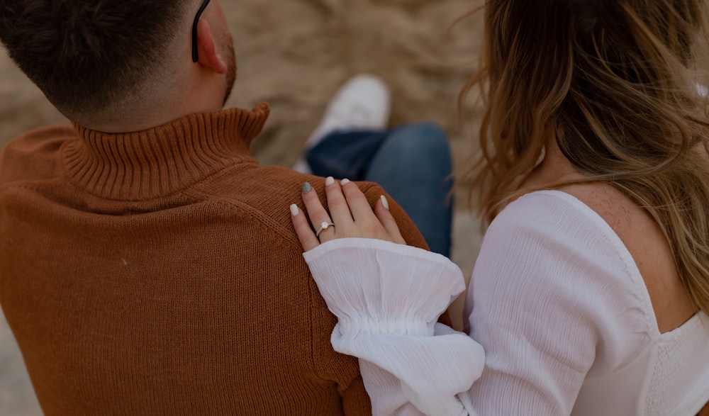 a man and woman holding hands